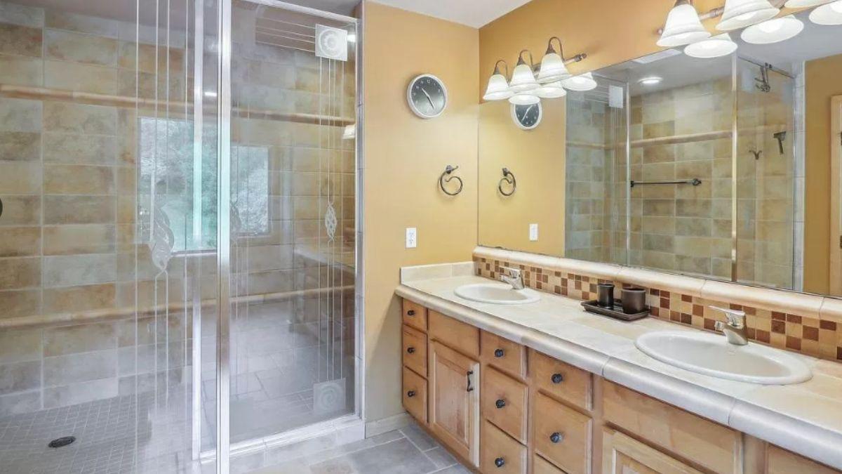 Craftsman Bathroom with Dual Vanities and Tiled Walk-In Shower
