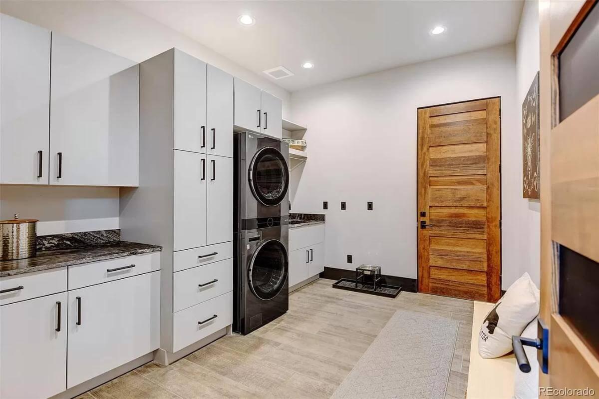 Functional Laundry Room Featuring Modern Appliances and Ample Storage