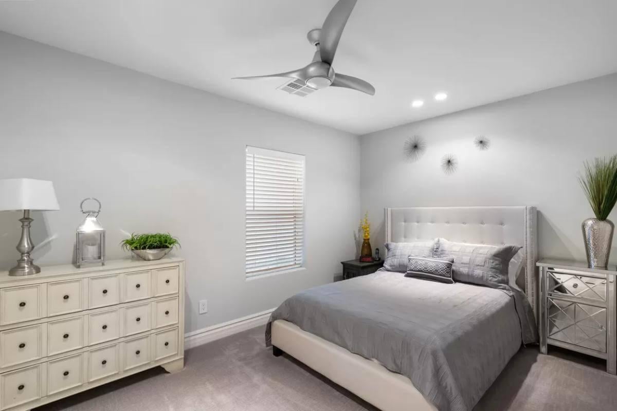 Elegance Meets Simplicity in This Bedroom with a Modern Fan