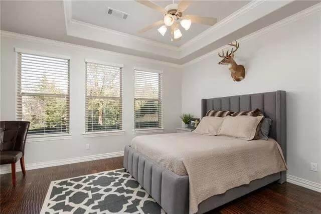 Check Out the Tray Ceiling and Rustic Touches in This Bedroom