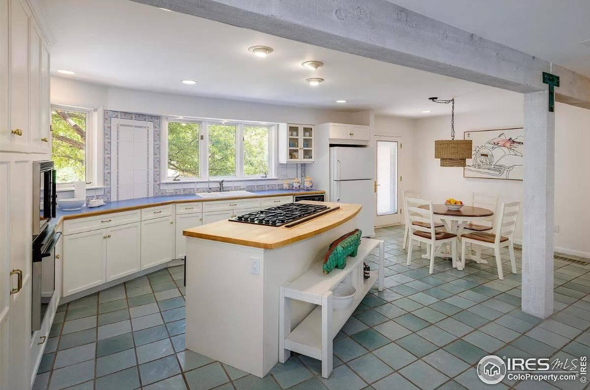 Spacious Kitchen with Island Cooktop and Vintage Flair