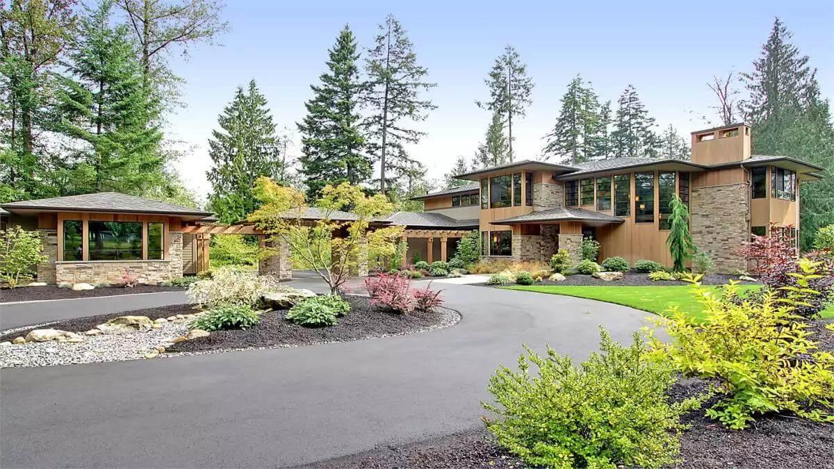 Craftsman Beauty Nestled Among Woodland with Charming Stone Accents