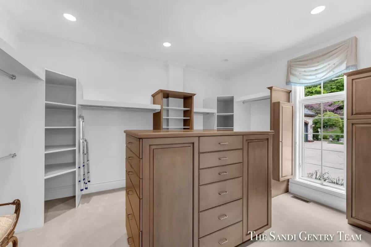 Step Inside This Spacious Walk-In Closet With Central Island