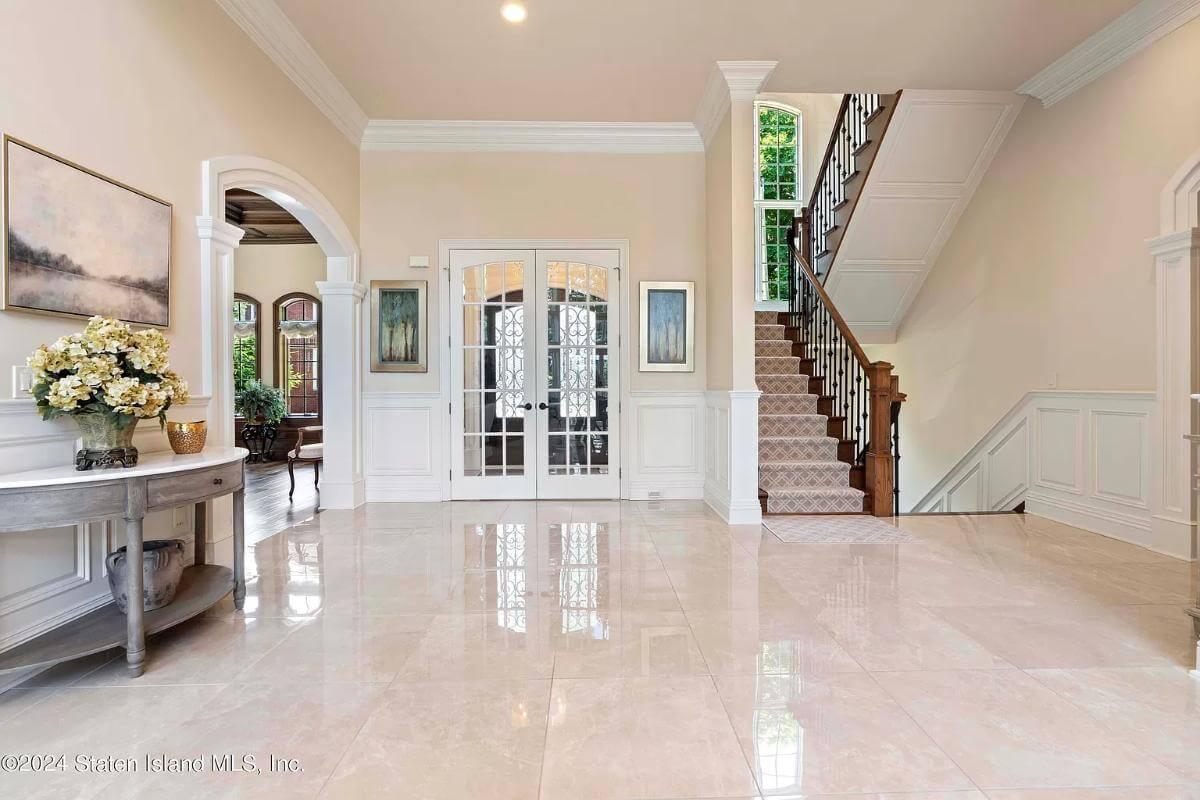 Look at the Polished Marble Floors and Graceful Staircase