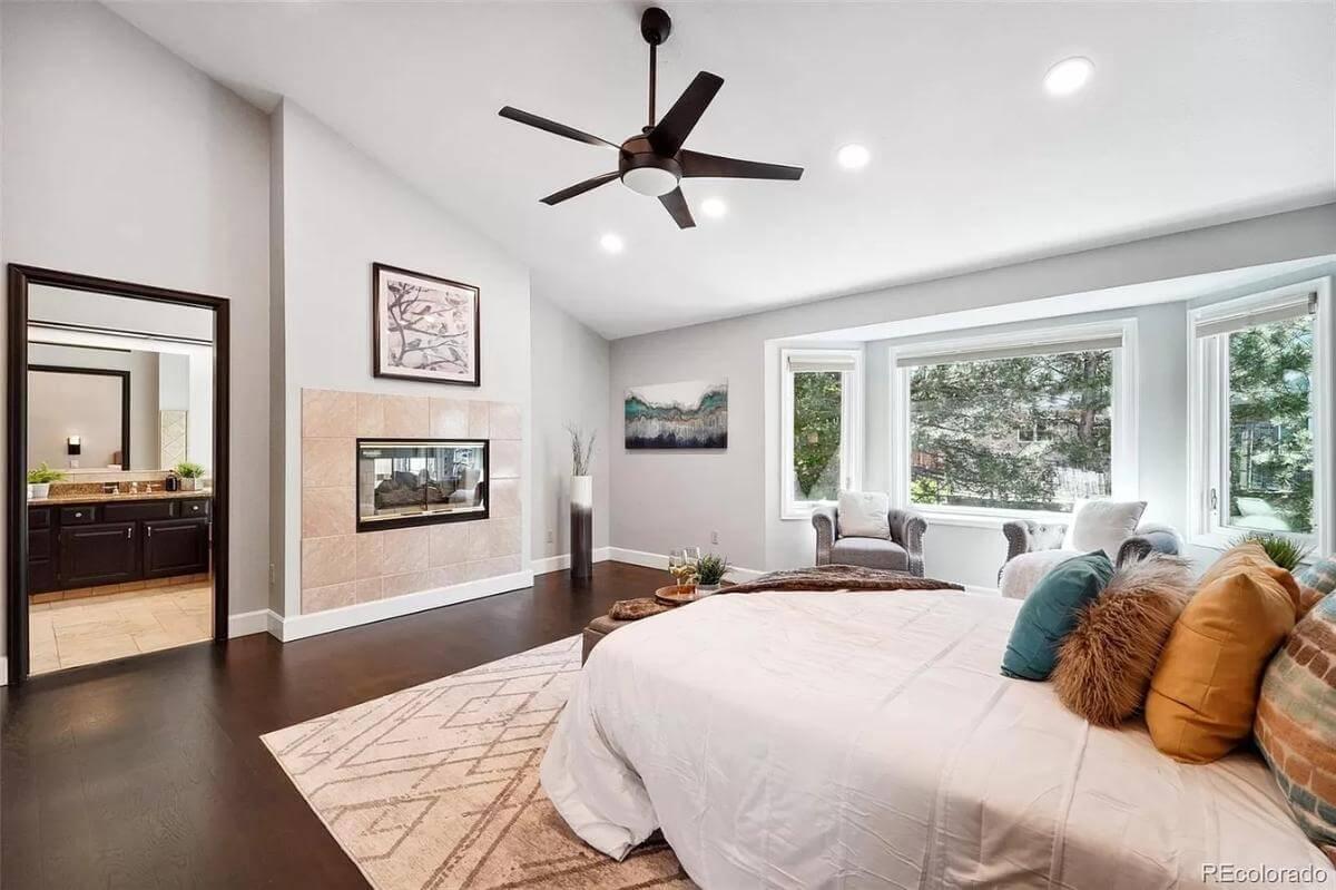 Enjoy the Dual-Sided Fireplace and Light-Filled Bay Window in This Bedroom Retreat