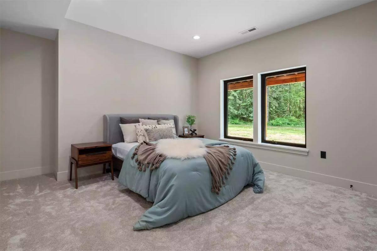 Relax in a Minimalist Bedroom with Woodland Views