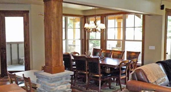 Dining Area with Large Windows and a Stone Pillar for Rustic Flair