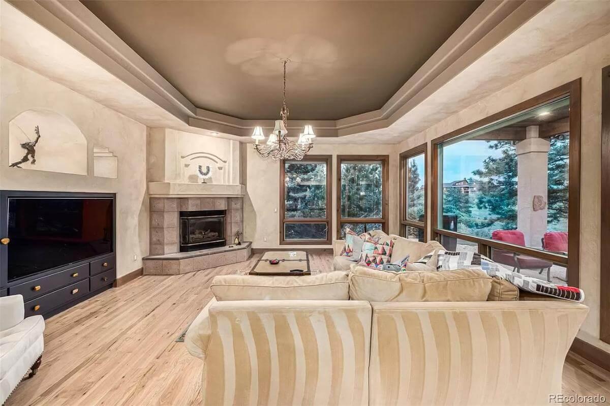 Living Room Elegance with Scenic Views and a Corner Fireplace