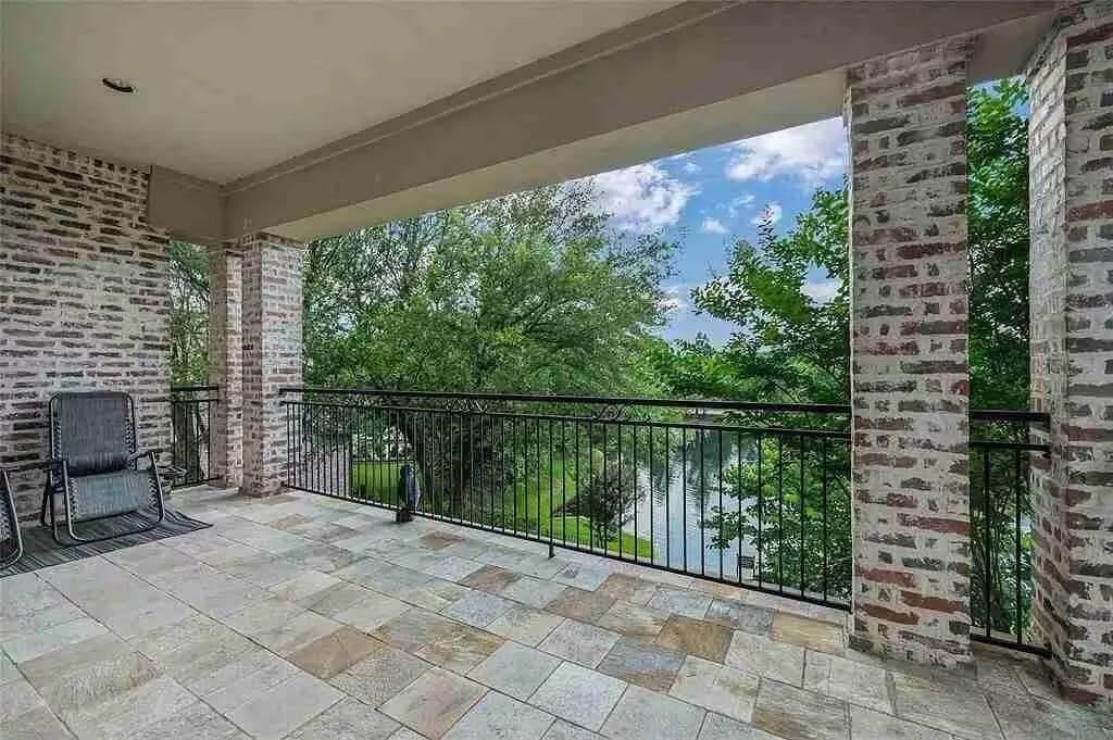 Enjoy the Serenity from This Brick Balcony Overlooking the Water