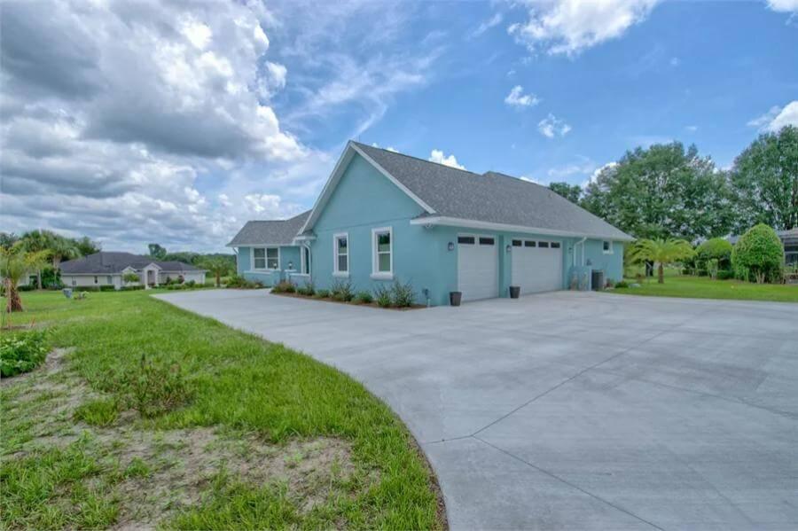 Generous Driveway and Garage in Bold Blue Craftsman Design