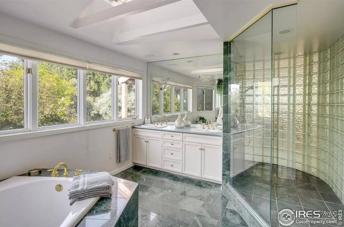 Luxurious Bathroom with Green Marble and Expansive Views