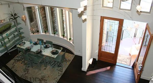 Look at Those Curved Windows Illuminating the Dining Area