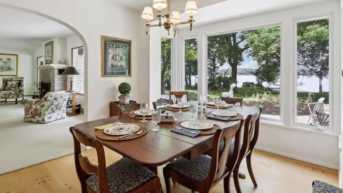 Dining Room Delight with Lakeside Views and Floral Accents