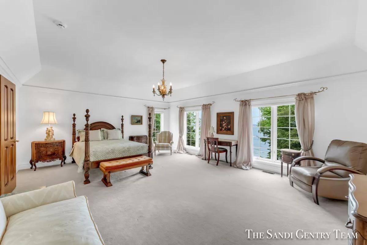 Grand Bedroom Featuring Elegant Four-Poster Bed and Coastal Views