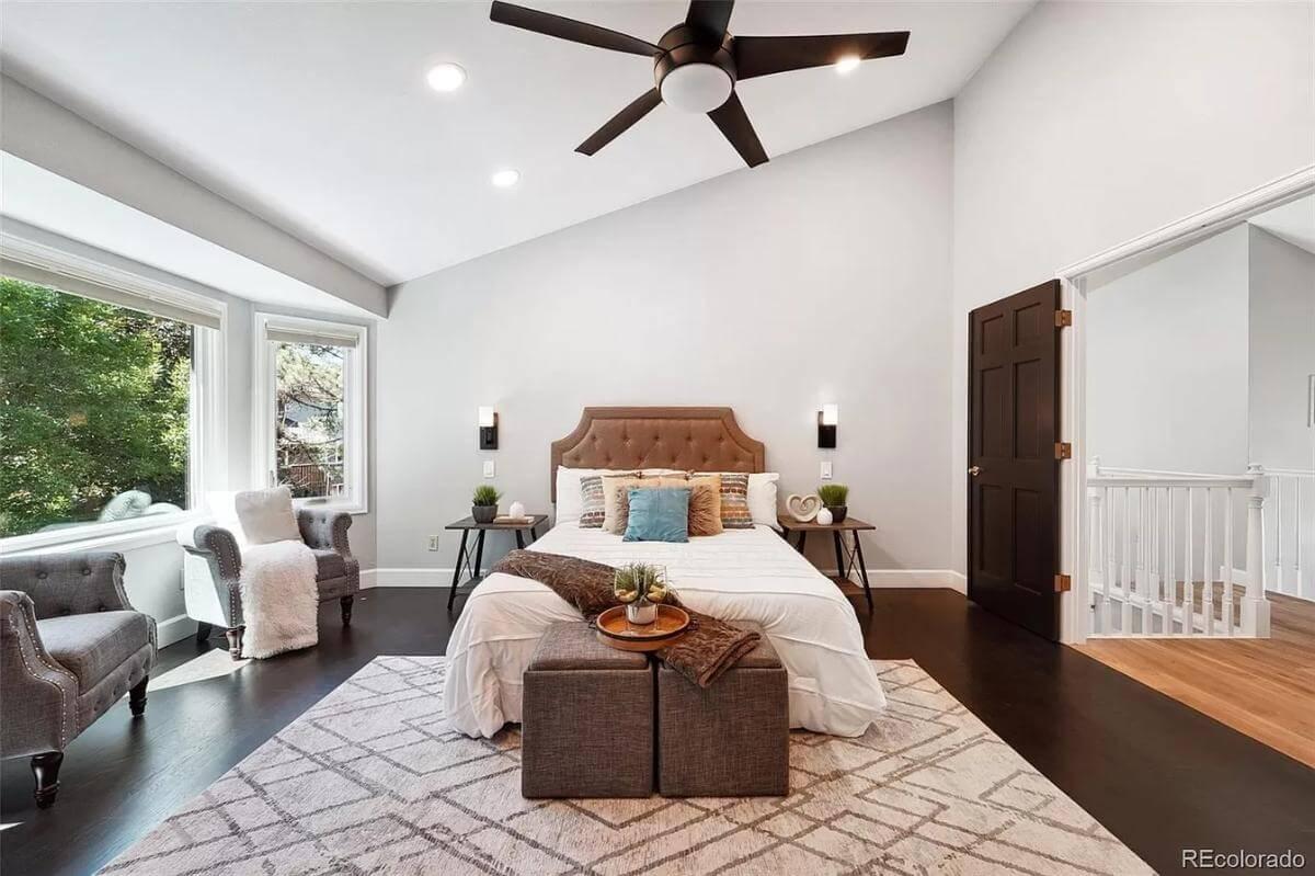 Relax in This Bedroom with Vaulted Ceilings and a Bay Window