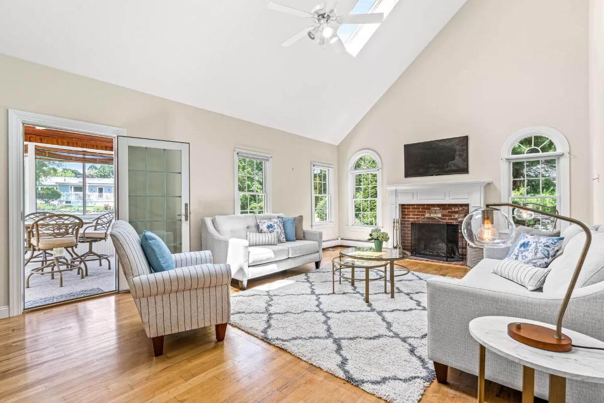 Look at This Bright Living Room with Skylights and Brick Fireplace