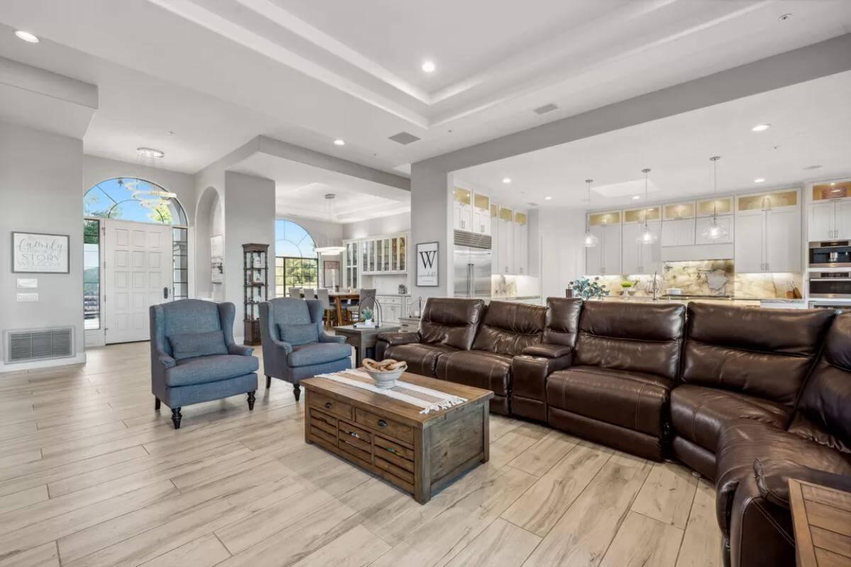 Check Out the Spacious Open Living Area with Elegant Tray Ceilings