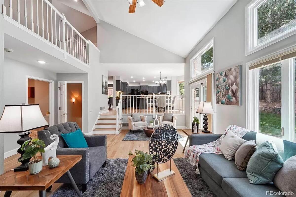 Notice the Transitional Flow and Vaulted Ceilings in This Open-Concept Living Space