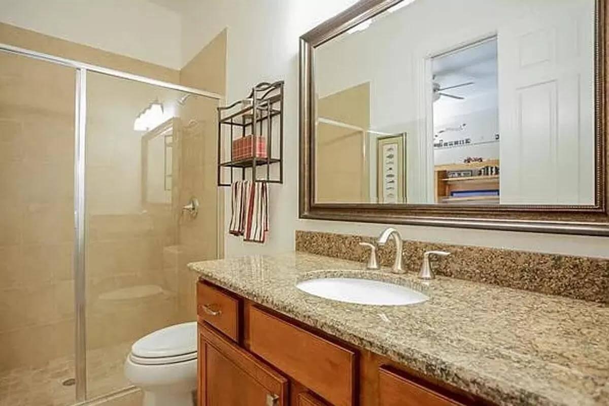 Classic Bathroom with Granite Countertop and Walk-In Shower