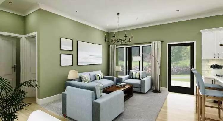 Inviting Living Area with Soft Green Walls and Cozy Fireplace