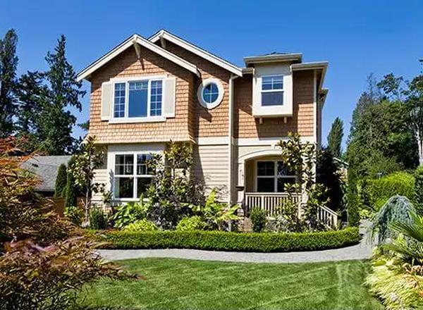 Craftsman Marvel with Cedar Shingle Accents and Lush Landscaping