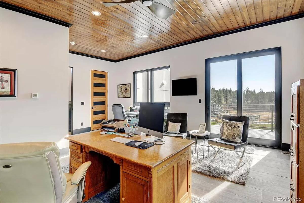 Home Office with a Cozy Wooden Ceiling and Expansive Views