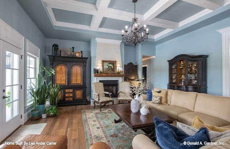 Cozy Living Room with Coffered Ceiling and Classic Fireplace
