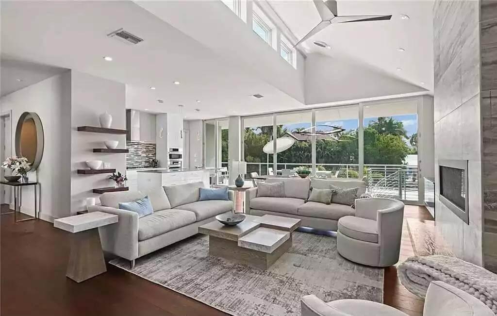 Sleek Living Room with Expansive Windows and Neutral Tones