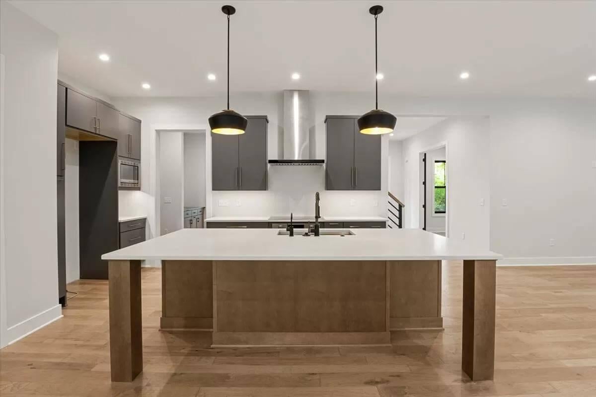 Sleek Kitchen Island with Pendant Lighting Steals the Show