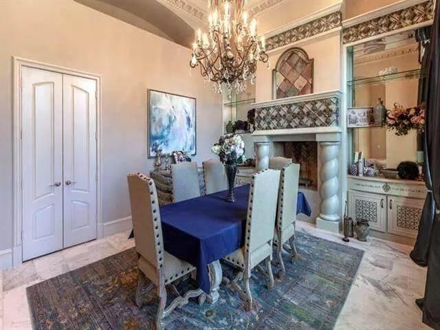 Wow, Look at the Ornate Fireplace in This Elegant Dining Room