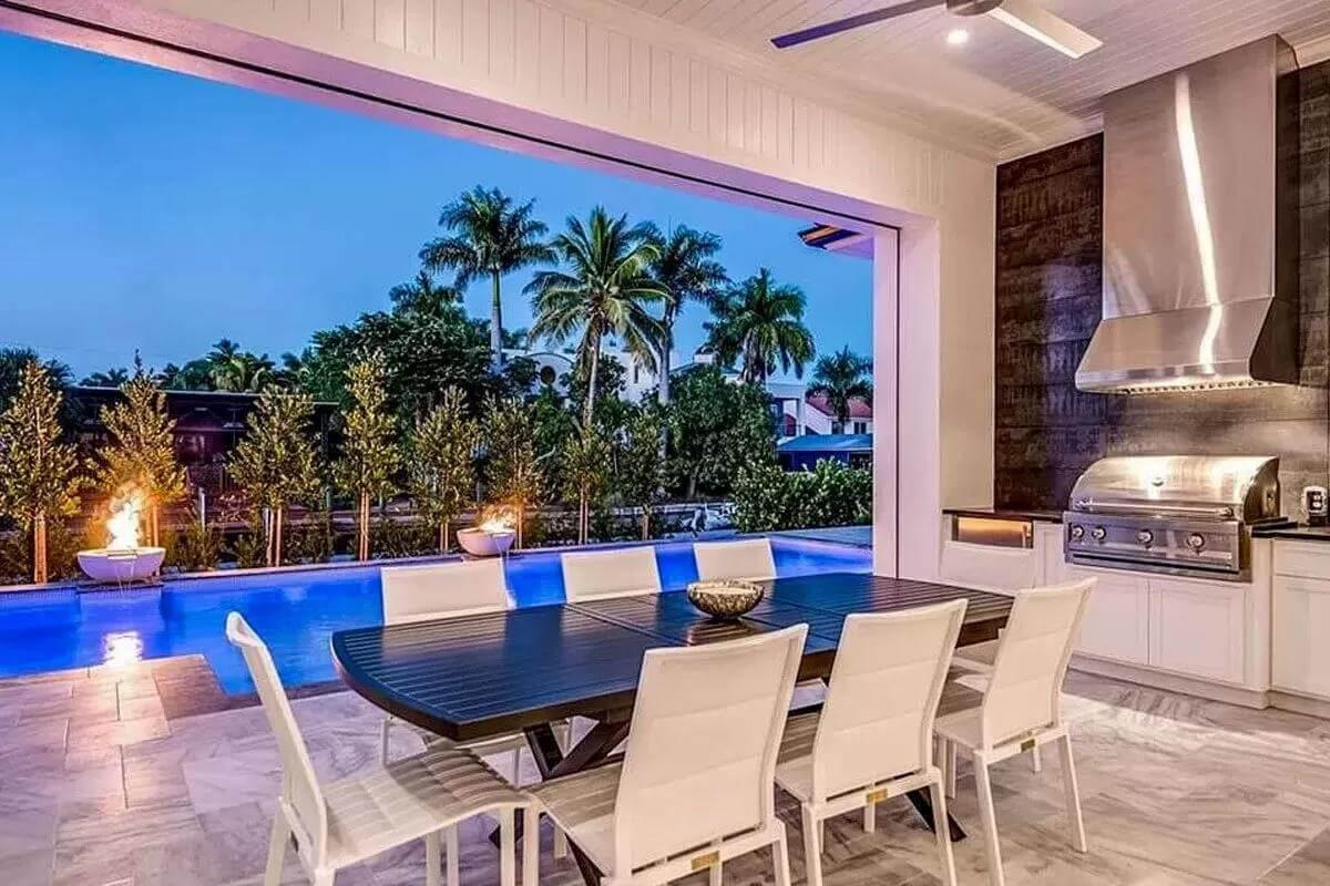 Outdoor Kitchen with Poolside Dining and Stunning Fire Features