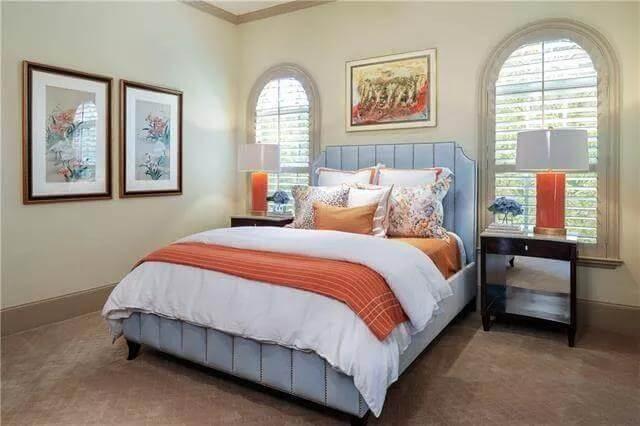Fresh Bedroom Vibes with Pops of Orange and Arched Windows
