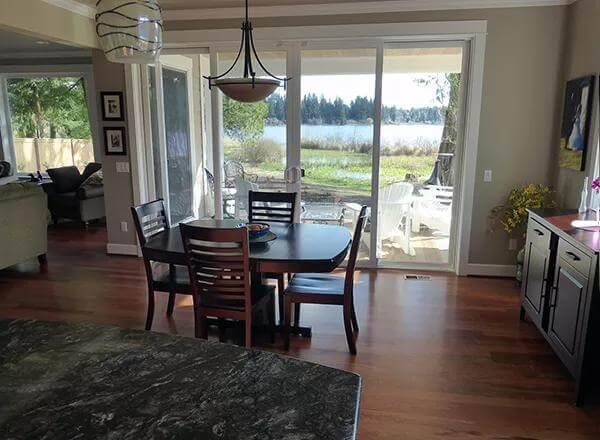 Take in the Breezy Dining Nook Overlooking a Serene Lake