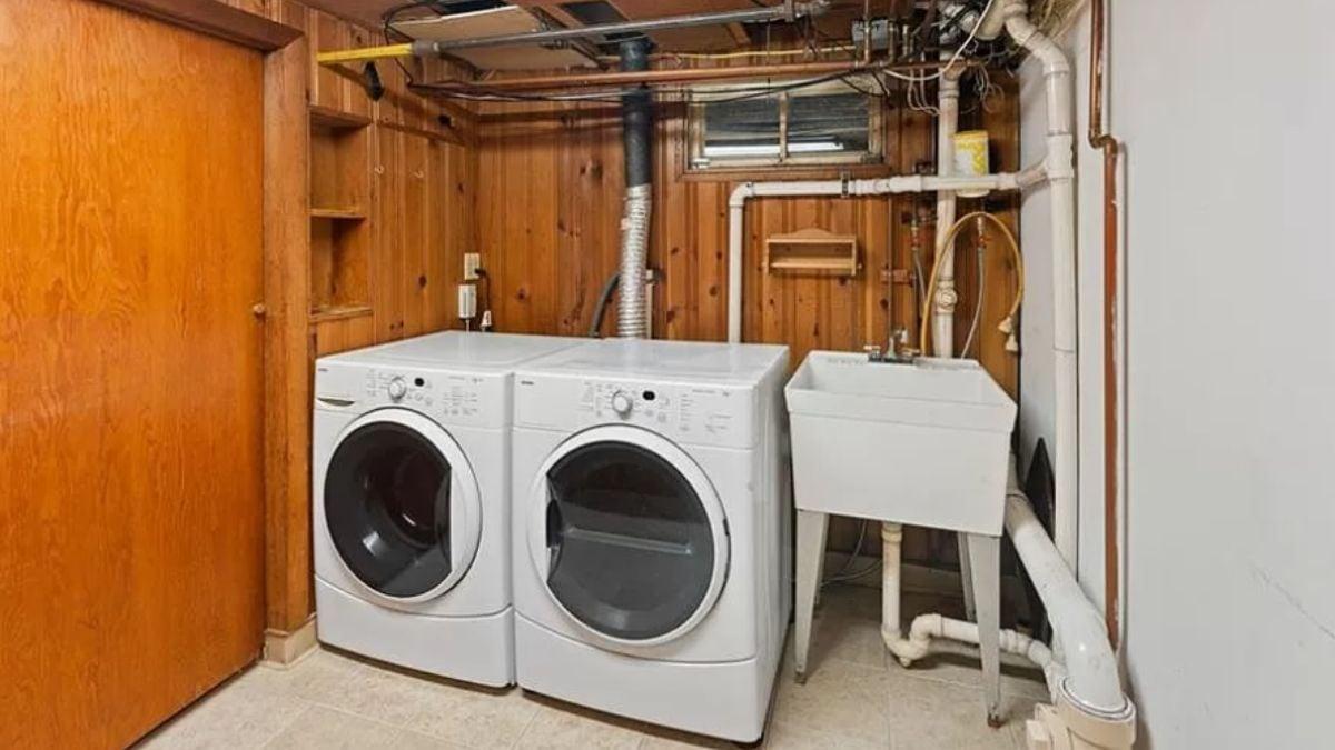 Efficient Laundry Space with Classic Wood Paneling