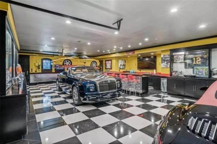 Rev Up in This Showroom-Style Garage with Checkered Flooring