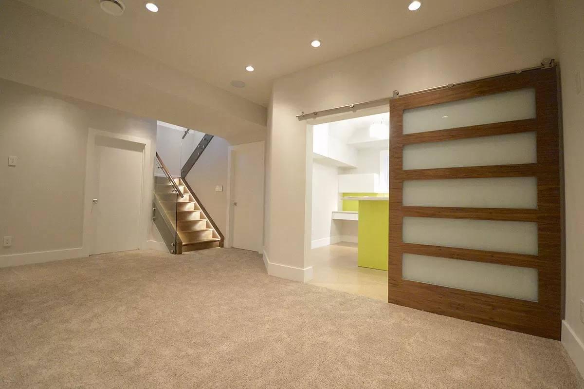 Notice the Modern Staircase with Glass Rails and Bright Accents
