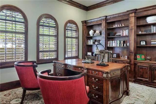 Classic Home Office with Rich Wooden Detailing and Elegant Desk Setup