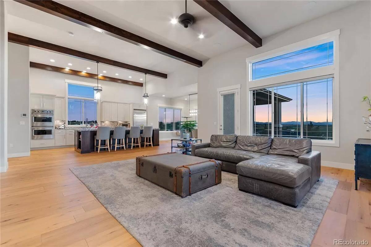 Spotlight on the Open Concept Living Area with Exposed Beams