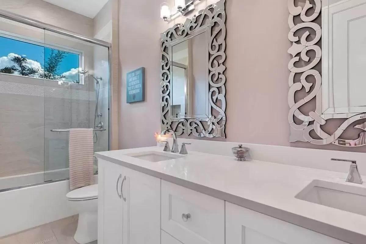 Notice the Intricate Mirror Frames in This Elegant Bathroom
