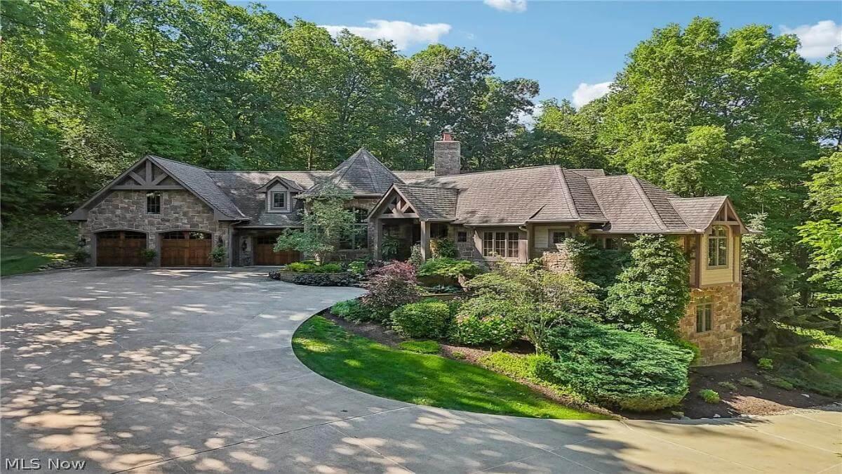Charming Stone Facade with Lush Landscaping