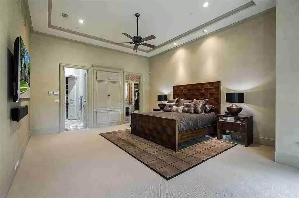 Relaxation Awaits in This Calm and Open Bedroom with a Textured Headboard