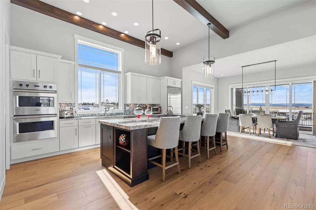 Admire the Elegant Kitchen Island and Inviting Dining Area