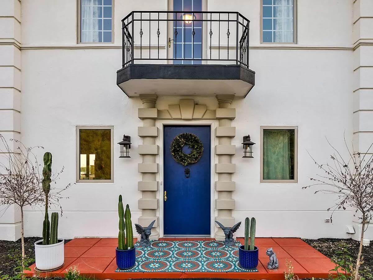 A Bold Blue Door Adds Flair to This Mediterranean Entryway