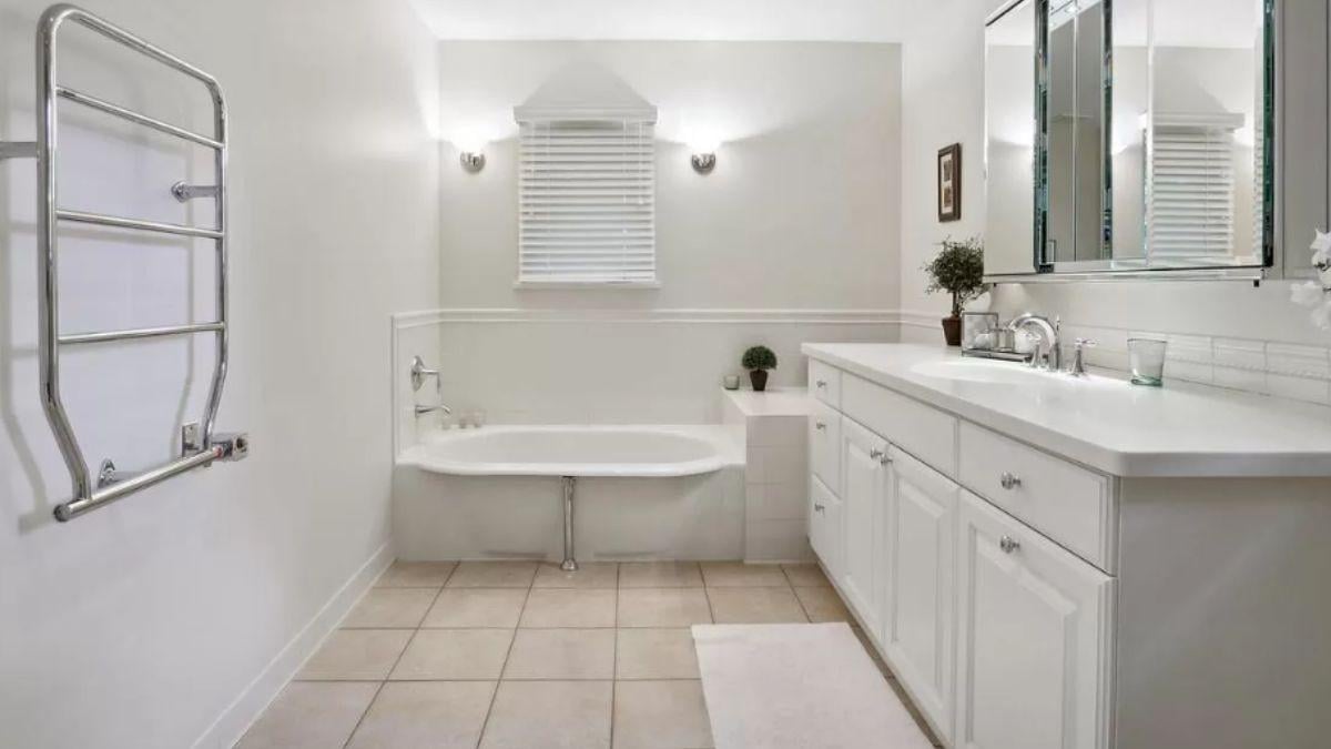 Minimalist Bathroom with Built-In Tub and Towel Warmer