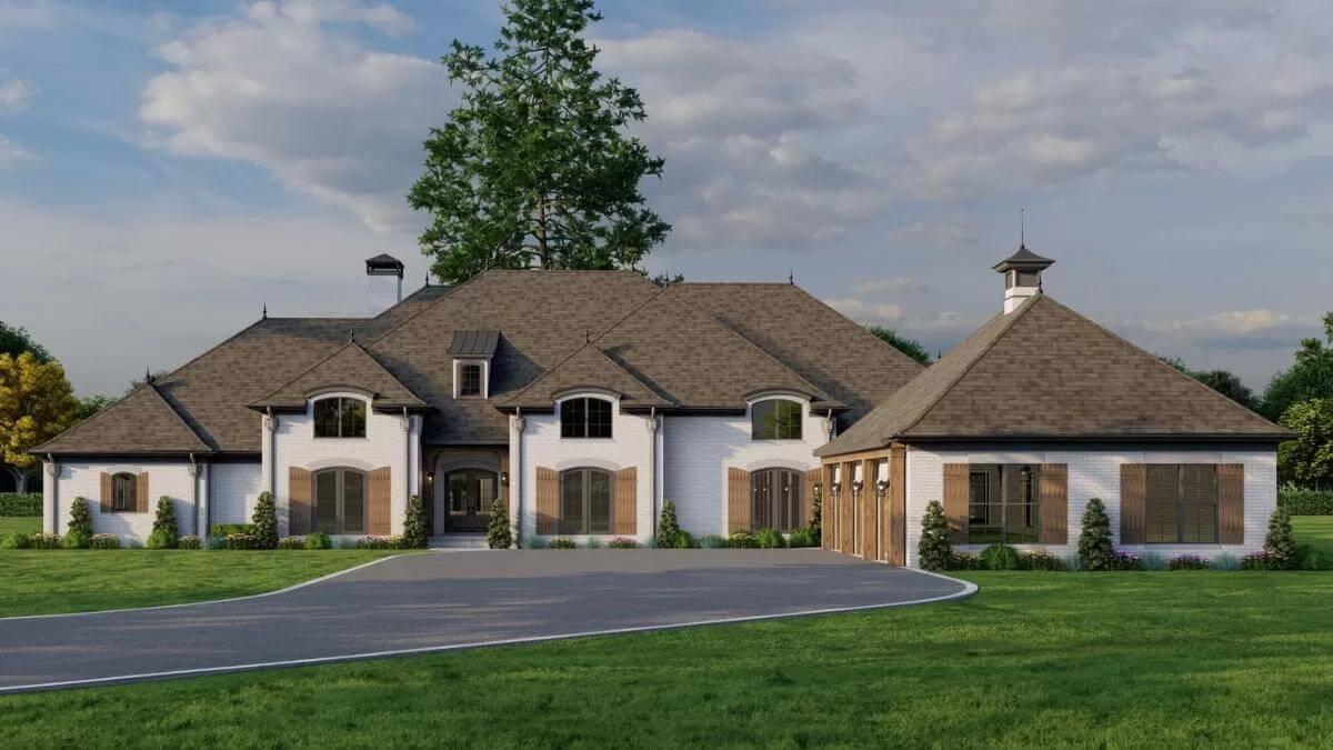 Traditional Elegance with Dual Chimneys and Arched Windows