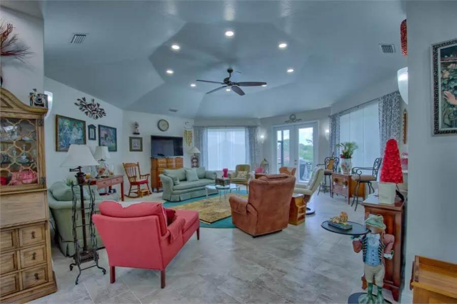 Eclectic Living Room with a Soaring Ceiling and Vibrant Accents