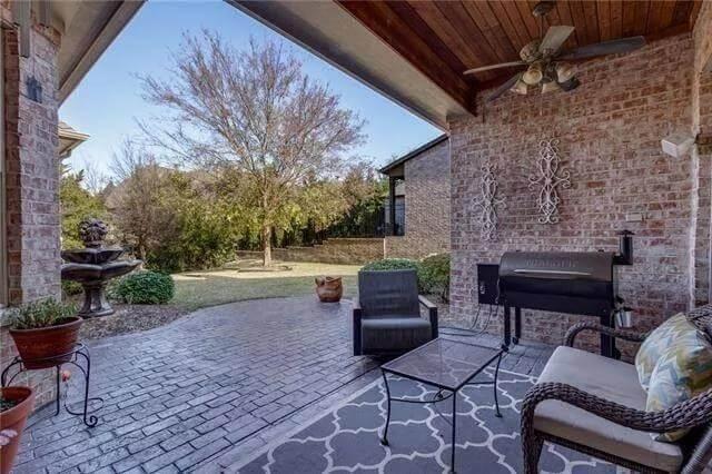 Enjoy Outdoor Relaxation Under a Wooden Pergola with Brick Accents