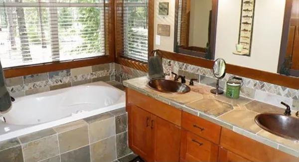 Craftsman Bathroom with a Garden Tub and Rich Wood Finishes