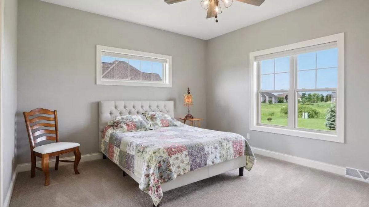 Relax in This Calming Bedroom with Patchwork Quilt