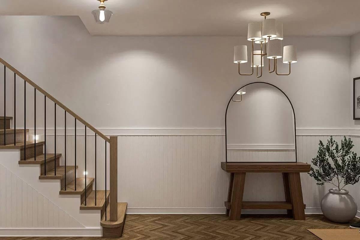 Elegant Entryway with Arched Mirror and Stylish Chandelier